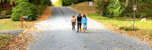 girls walking a dog